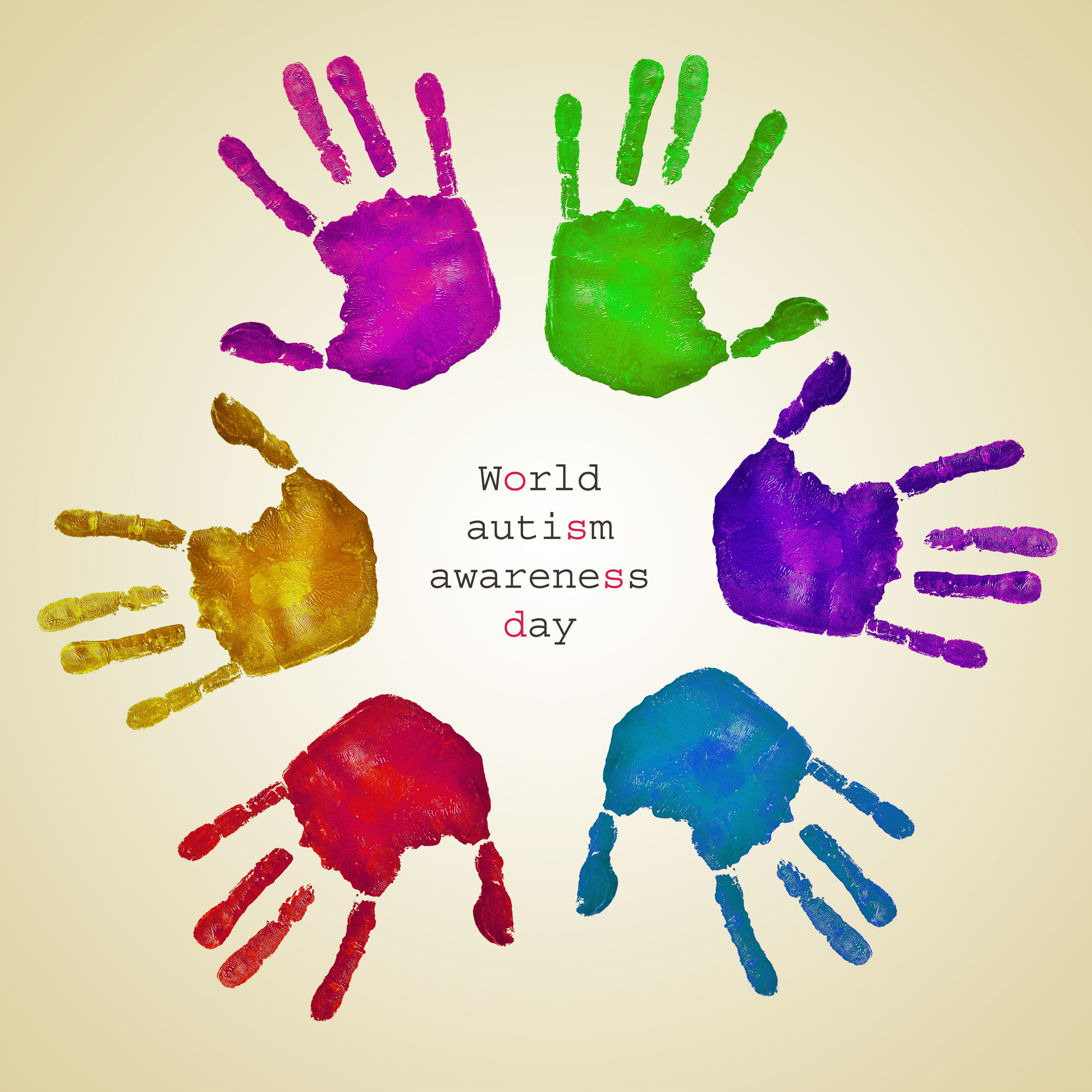 handprints of different colors and text world autism awareness day