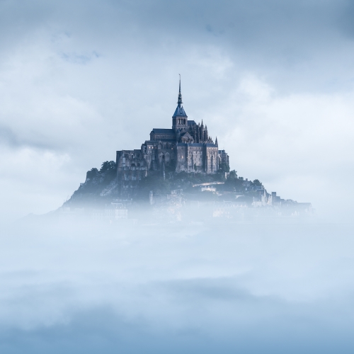 mont st. michel with clouds