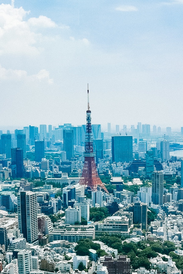 the Tokyo Tower with city skyscrapers