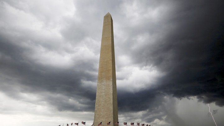 Storm clouds hover above the Washington monument in Washington DC
