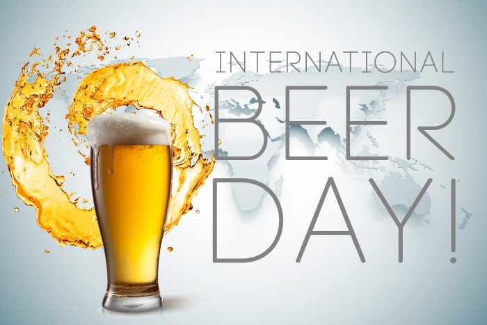 international beer day beer splash out of mug