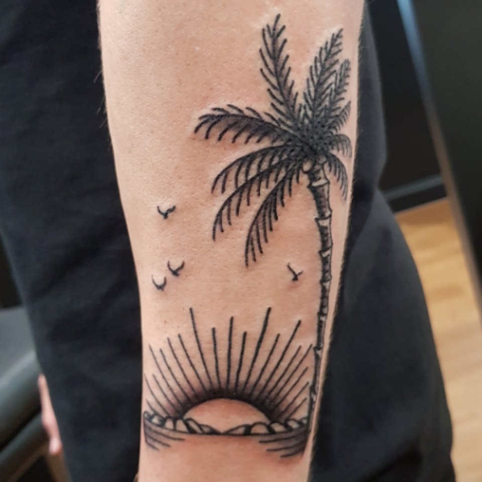 Black Palm Tree & Sunset Tattoo On Arm by Levi Bell
