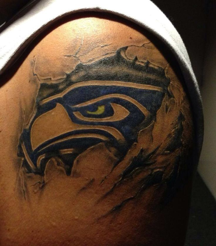 Ripped Skin Seattle Seahawks Tattoo On Men Shoulder