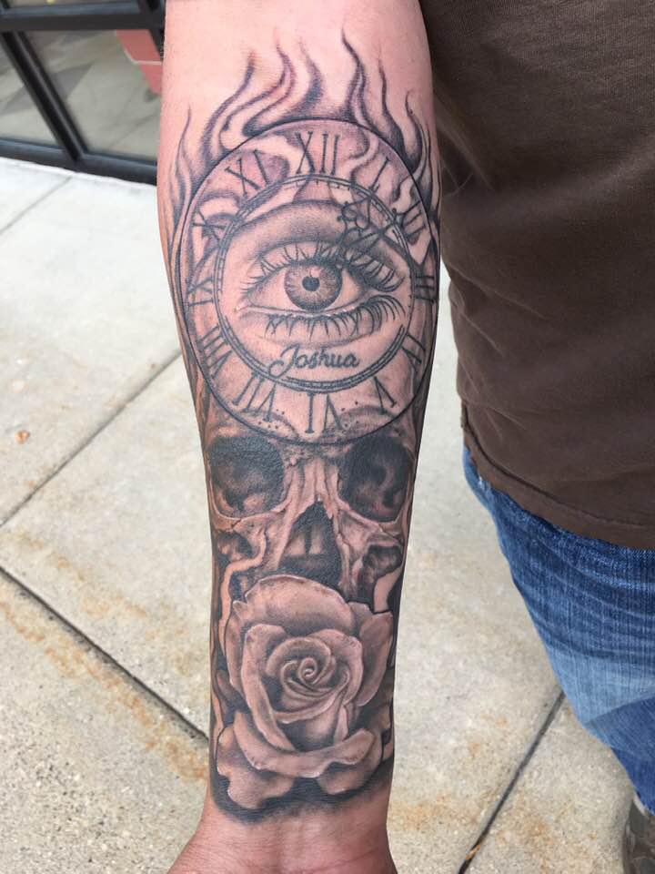 Amazing Skull, rose and eye tattoo on forearm by Zak Schulte
