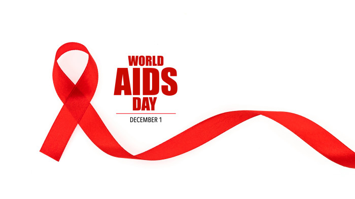 Red ribbon for World AIDS Day on white background