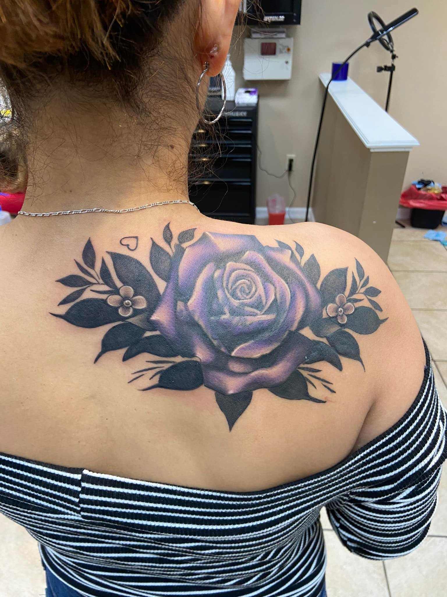Amazing Purple Rose Tattoo On Girl Back Shoulder By Zak Schulte