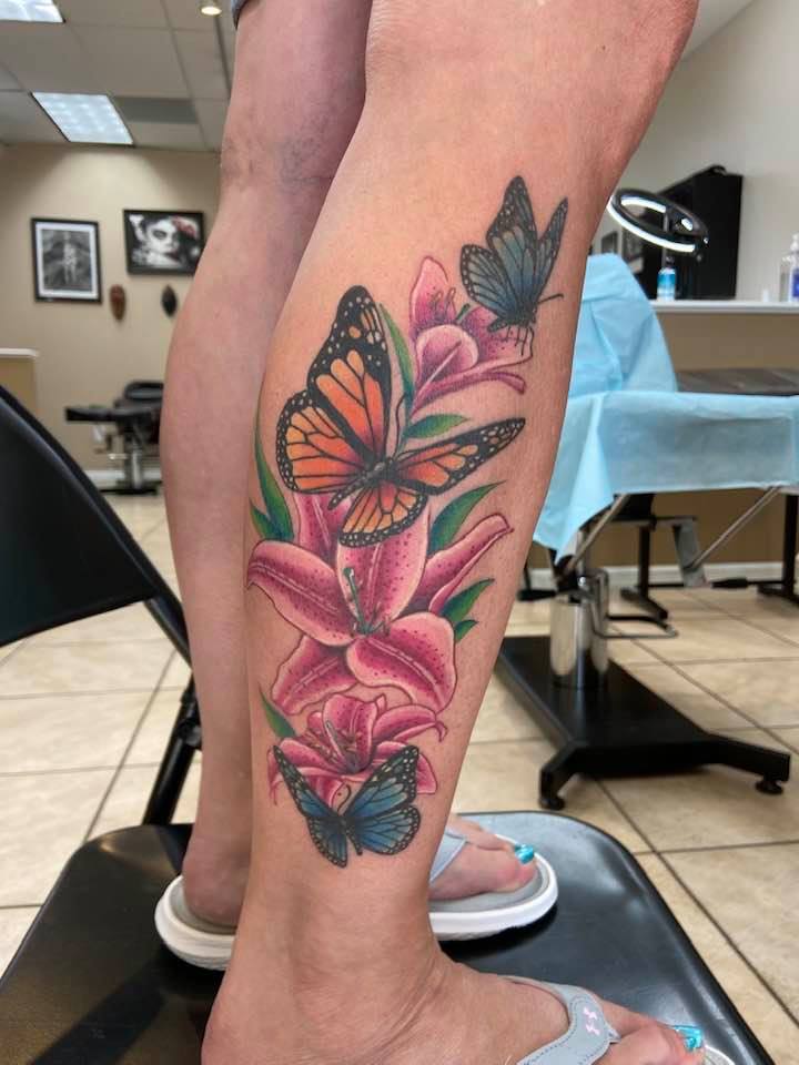 Beautiful Floral leg tattoo for girls by Zak Schulte
