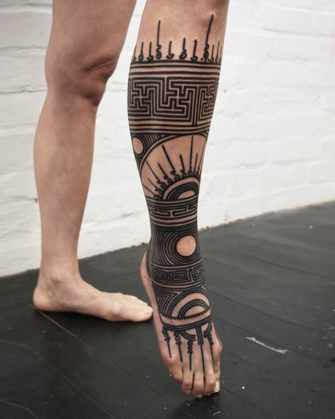 Black ink geometrical design leg tattoo by Black Ink Power