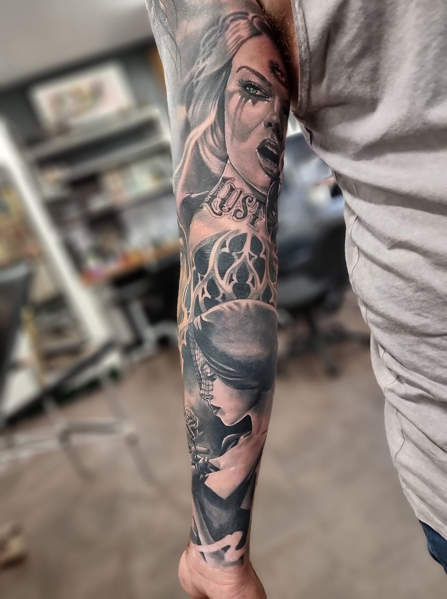 Grey ink full sleeve portrait tattoo by Levi Bell