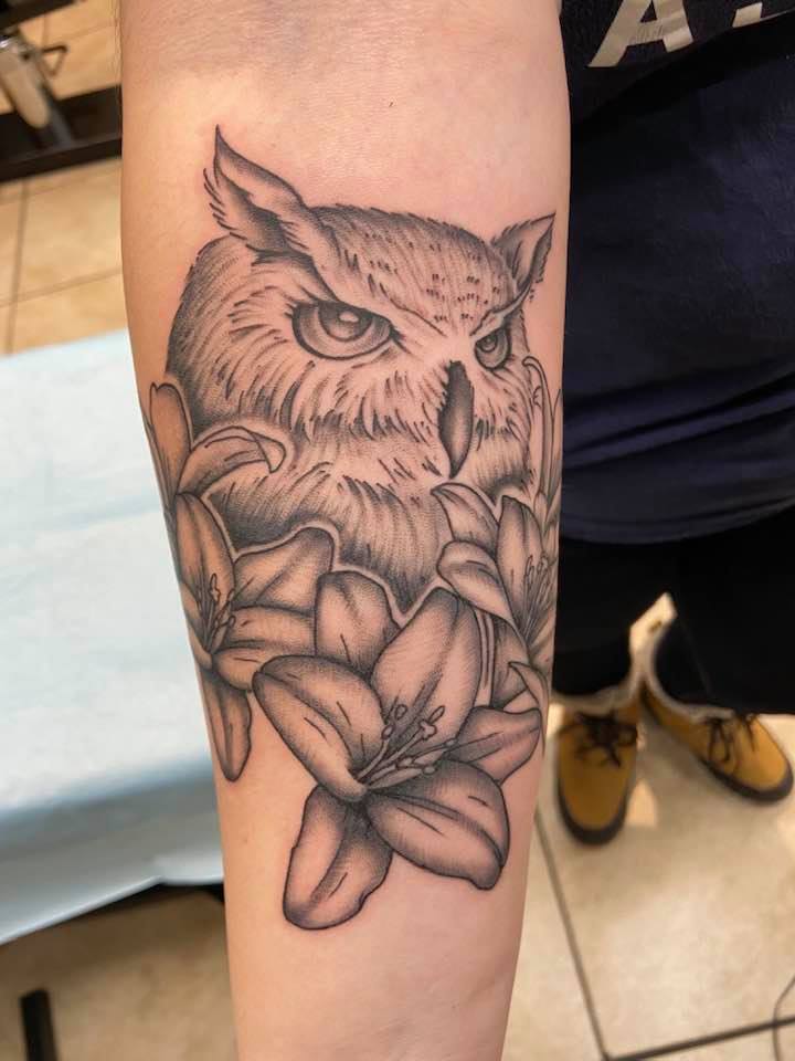 Owl tattoo on forearm by Zak Schulte