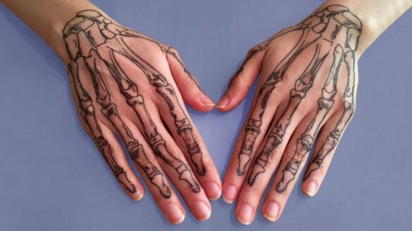 Skull hands Tattoo By Ava Max