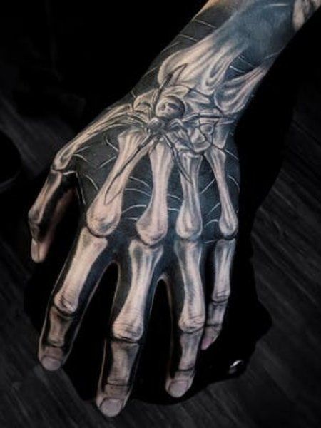 Terrifying Black Ink Skeleton Hand Tattoo