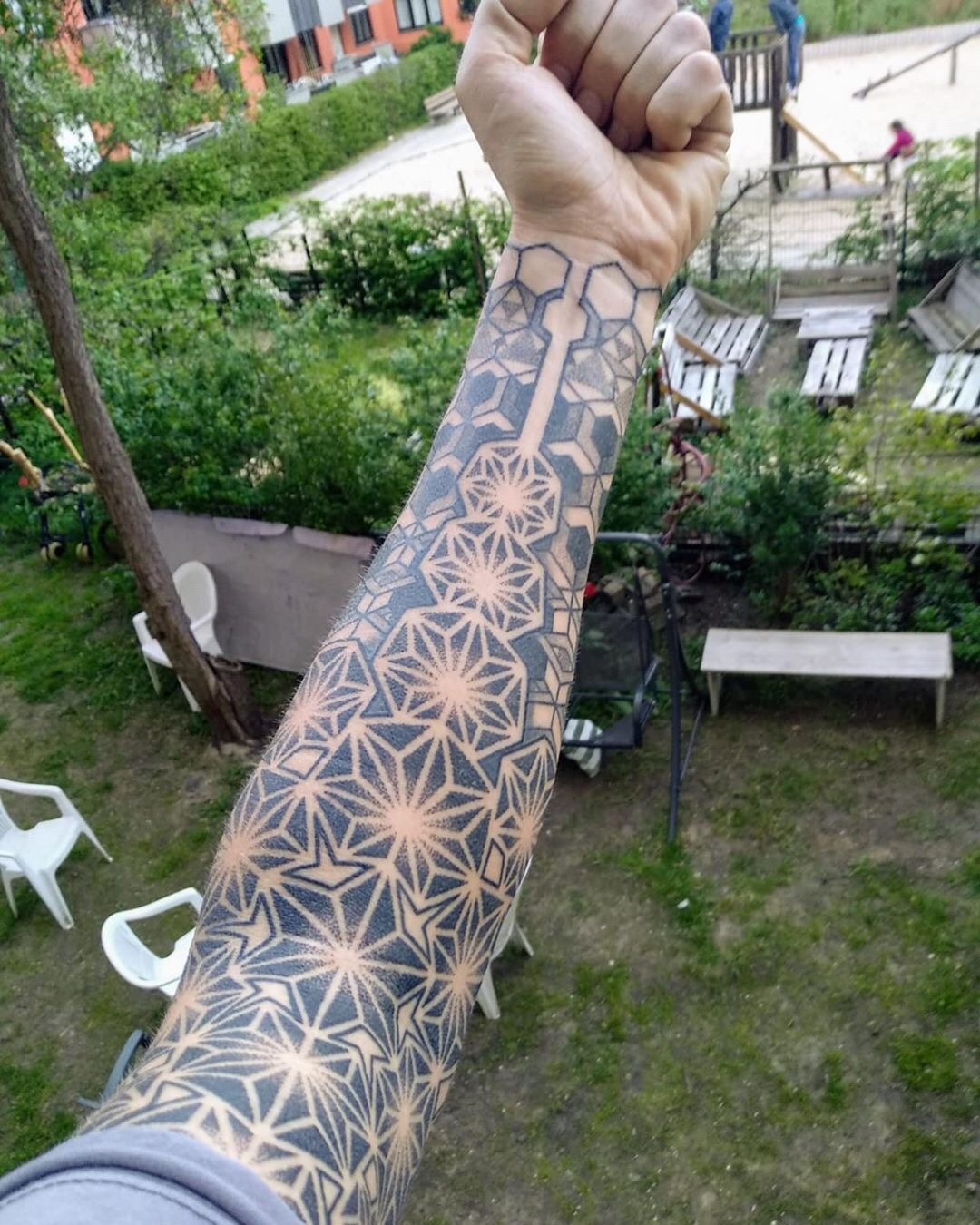 Amazing geometric floral tattoo on arm by Black Ink Power