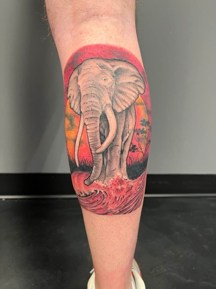 Cool elephant tattoo on leg calf by Zak Schulte