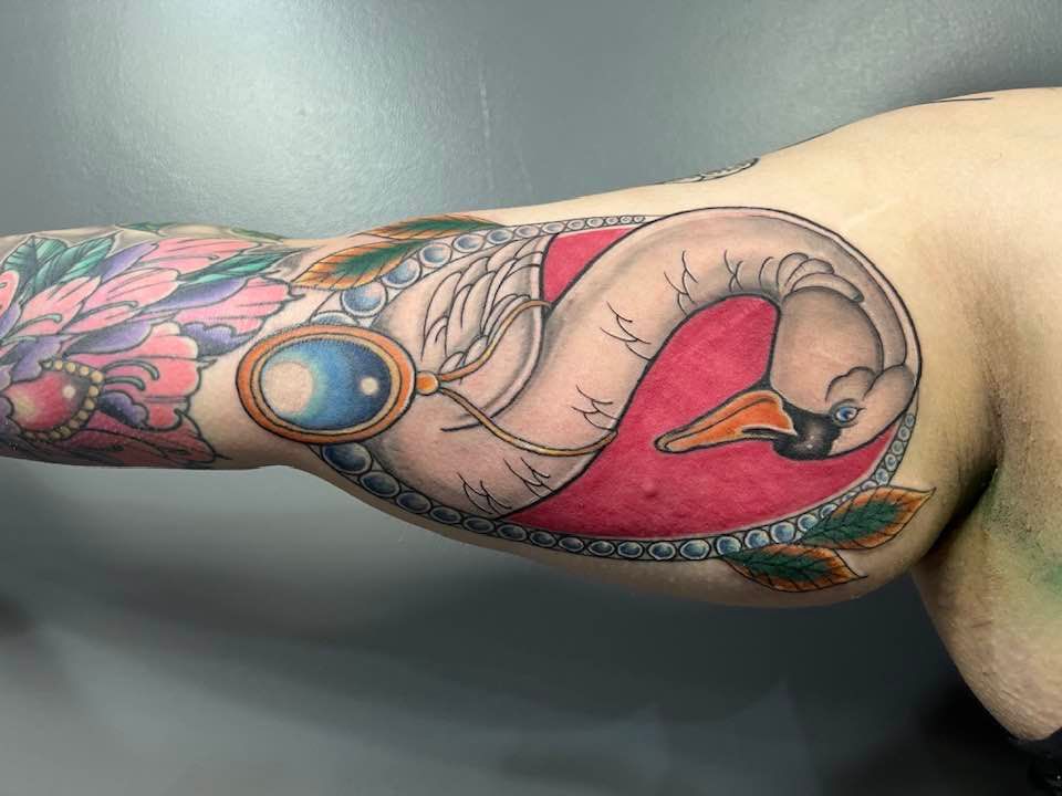 Colorful Swan Tattoo On Bicep By Zak Schulte