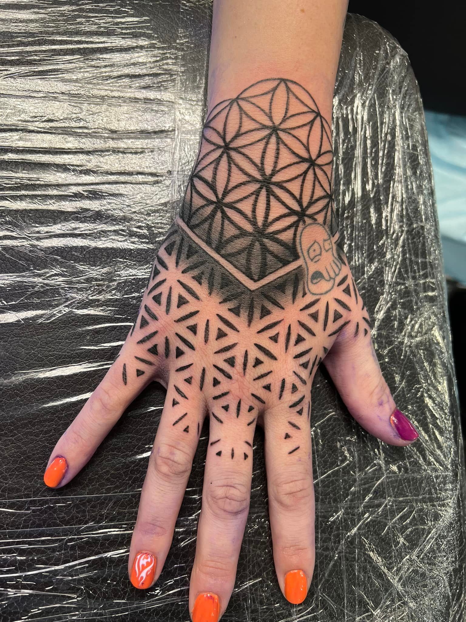 Geometric floral hand tattoo for girls