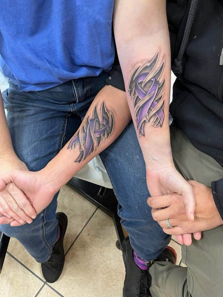 Matching lupus tattoos for a very nice couple